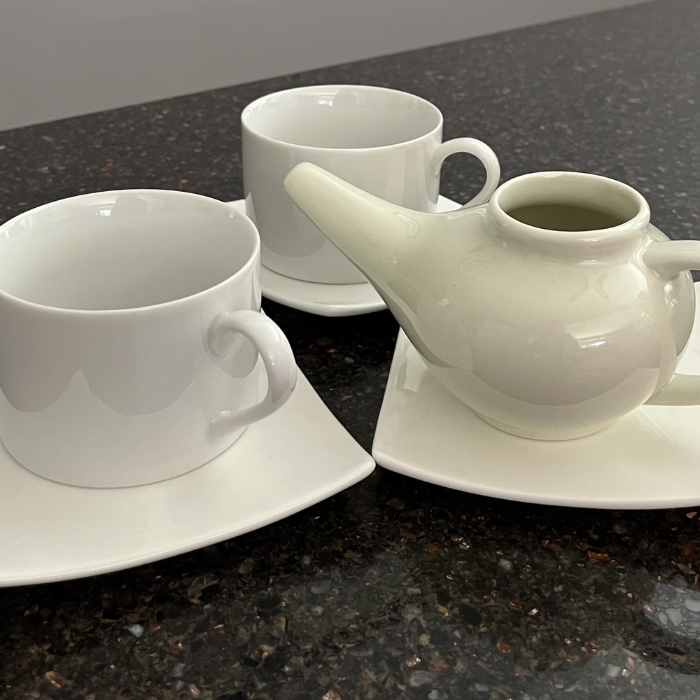 Elegant White Tea Set with Cups and Teapot